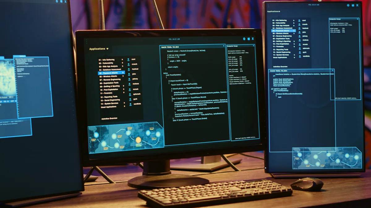 Cybersecurity code on multiple computer monitors